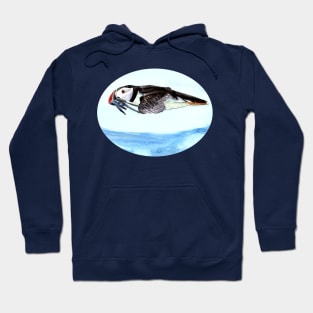 Atlantic Puffin flying over the ocean Hoodie